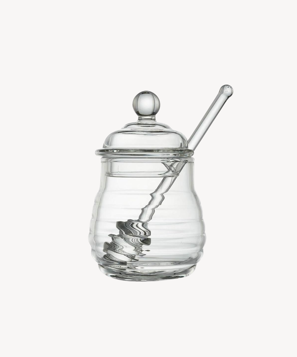 Glazen honingpot met lepel